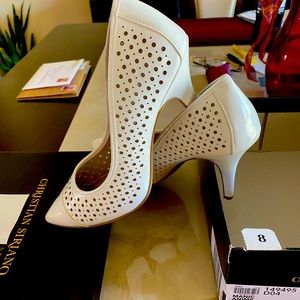 Woman’s white heels